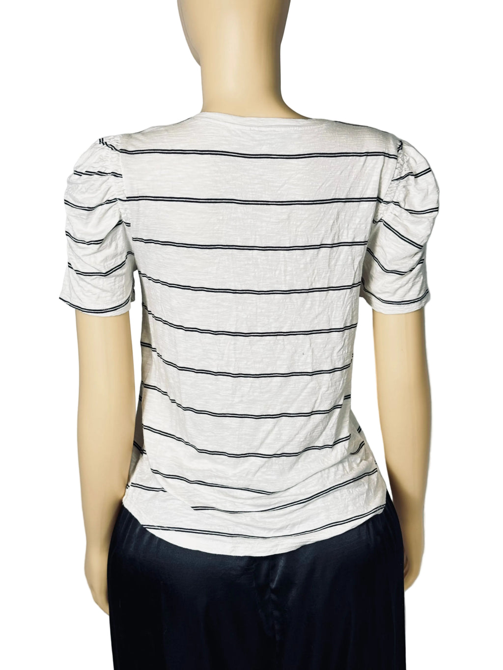 A short-sleeve striped top displayed on a mannequin from the back. The top is off-white with thin dark horizontal stripes and puffed sleeves, paired with dark navy pants.